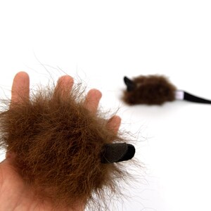 real buffalo bison fur cat toy mouse in hand to show size