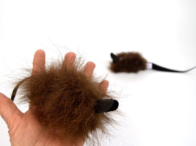 real buffalo bison fur cat toy mouse in hand to show size