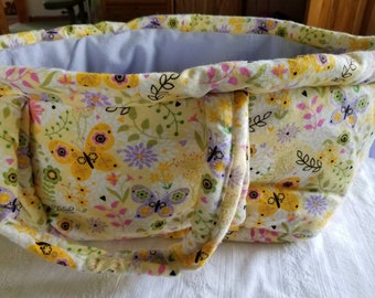 Baby Doll Carrier, Bed,or Bassinet. It has floral and butterflies designs.