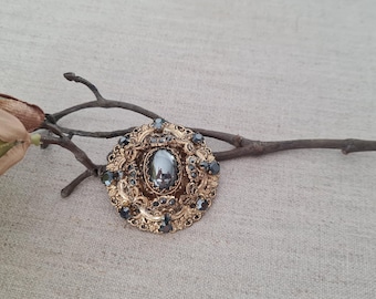 Baroque style brooch, hematite rhinestones, 1970s