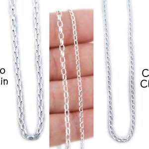 May include: Three silver chain styles are displayed against a white background. The chains are labeled "Rolo Chain" and "Curb Chain". The Rolo chain has oval links, while the Curb chain has flattened, interlocking links. The middle chain is a close-up of the Rolo chain.