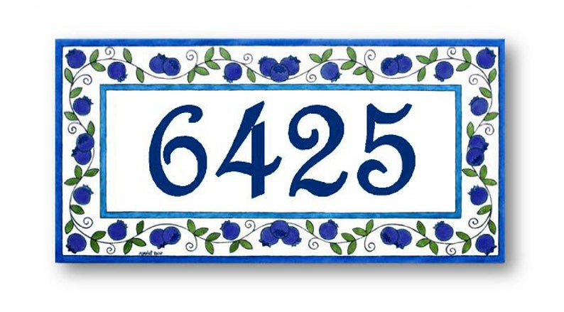 May include: Blue and white ceramic house number sign with a blueberry design. The number 6425 is displayed in a blue cursive font.