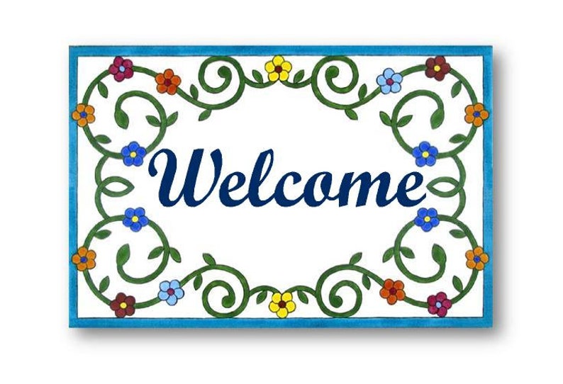 May include: A white ceramic welcome sign with a blue border and a green floral design. The word "Welcome" is written in blue cursive lettering.