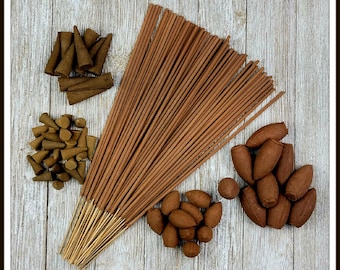 May include: A variety of incense products, including brown sticks, brown cones, and brown incense cones. The incense is arranged on a wooden surface.