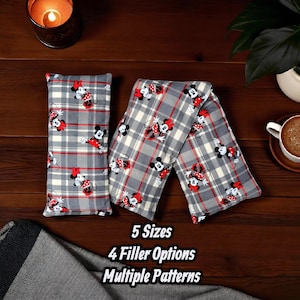 May include: Two gray plaid fabric items with a Minnie Mouse pattern. One is rectangular, the other is long and folded. The pattern includes red bows and black mouse silhouettes. The text on the image says "5 Sizes", "4 Filler Options", and "Multiple Patterns".