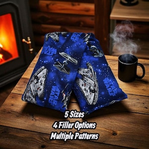 May include: Blue Star Wars-themed pillow with images of the Millennium Falcon and TIE fighters against a starry background. The text "STAR WARS" is printed on the pillow. The image also includes the text "5 Sizes", "4 Filler Options", and "Multiple Patterns".