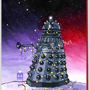 May include: A festive Christmas card featuring a Dalek decorated with colourful Christmas lights and a TARDIS in the background. The card is signed "Carly Edwards Art".