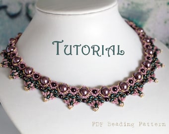 May include: A beaded necklace with a delicate design featuring pink and green beads. The necklace is on a white mannequin bust. The text "TUTORIAL" is written in green above the necklace. The text "PDF Beading Pattern" is written below the necklace.