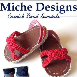 May include: Two doll sandals with red braided straps and brown soles. The sandals have white stitching and a pink strap. The image includes the text "Miche Designs Carrick Bend Sandals" and "A Step-by-Step Guide to Making Sandals For 18 Inch American Girl Dolls Intermediate Level PDF Sewing Pattern."