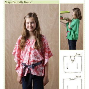 May include: A girl is wearing a pink and white butterfly blouse with a grey sash. The blouse has a tie-front neckline. The pattern on the blouse resembles a tie-dye effect. The image also shows a line drawing of the blouse's front and back.