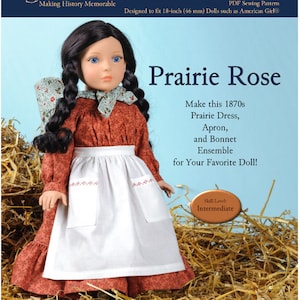 May include: A PDF sewing pattern for a Prairie Rose doll outfit, designed for 18-inch dolls. The pattern includes a dress, apron, and bonnet. The doll is wearing the outfit and is sitting in a pile of hay. The pattern is titled "Prairie Rose" and is labeled "1870-03".
