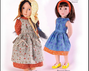 May include: A PDF sewing pattern for a 16-inch (40 cm) doll dress. The pattern includes two dress designs: a past dress with a floral print and a present dress with a blue and orange print. The pattern is titled "Country Girl" and is labeled "Easy" for skill level.