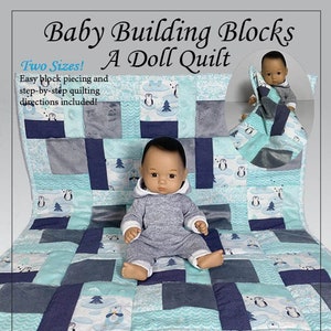May include: A PDF pattern for a baby doll quilt with two sizes, designed for 8-inch and 18-inch dolls. The quilt features a blue and gray color scheme with a penguin and snowflake design. The pattern is called "Baby Building Blocks A Doll Quilt" and is by Stitchery and Snowflakes.