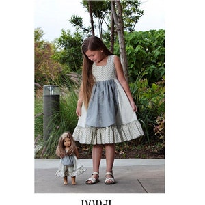 May include: A sewing pattern for a girl's dress called "Dorsi" by Gennie Wren Designs. The pattern is for an Euro style dress sized for ages 1-8, 10, 12, 14, and 16. The sewing level is intermediate.