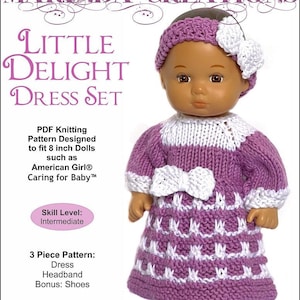 May include: A knitting pattern for a doll dress set, featuring a purple and white dress, headband, and shoes. The pattern is designed for 8-inch dolls, such as American Girl dolls. The pattern is made with 4-ply cotton yarn and 2.75 mm needles. The skill level is intermediate.