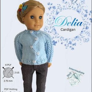 May include: A doll in a light blue knitted cardigan with white heart-shaped buttons and dark grey striped trousers. The image features text: "Delia Cardigan" and "PDF Knitting Pattern Designed to fit 45.7 cm dolls such as American Girl®."