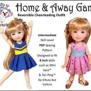 May include: A doll wearing a reversible cheerleading outfit. One side is a blue pleated skirt with a yellow top. The other side is a pink dress with a blue top. The image includes text that says "Home & Away Game" and "Reversible Cheerleading Outfit".
