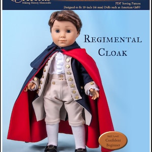 May include: A red and blue fabric doll cloak sewing pattern for 18-inch dolls. The pattern is titled "Regimental Cloak" and is designed to fit dolls such as American Girl. The pattern is for a confident beginner skill level.