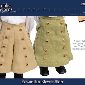 May include: Two doll skirts, one khaki and one olive green, are displayed. Each skirt features multiple decorative buttons and pockets. The text reads "Edwardian Bicycle Skirt" and "A Sporty Split Skirt that Quickly Converts to a "Proper" Skirt with the Turn of a Flap!"