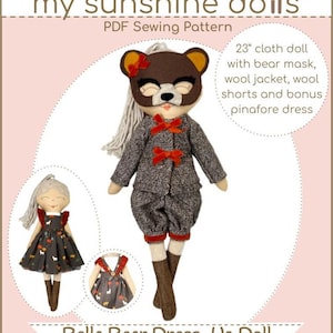 May include: A sewing pattern for a 23-inch cloth doll with a bear mask, wool jacket, wool shorts, and a bonus pinafore dress. The pattern is called "Bella Bear Dress-Up Doll" and is part of the "Woodland Collection".