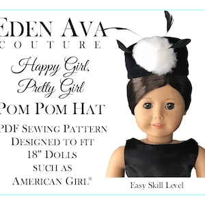 May include: A black and white pom pom hat with feathers, designed to fit 18-inch dolls. The hat is labeled "Happy Girl, Pretty Girl Pom Pom Hat" and "Easy Skill Level".