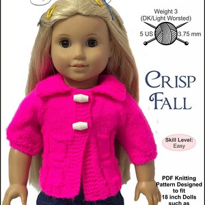 May include: A doll wearing a bright pink knitted jacket with white closures and a collar, paired with blue denim pants. The text "CRISP FALL" is visible. The pattern is designed for 18-inch dolls.