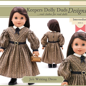 May include: A doll wearing a brown and black striped dress with a white collar and black bow. The dress has a black belt with a gold buckle. The doll is holding a small brown book. The image text reads "Keepers Dolly Duds Designs...real clothes for real dolls Intermediate #KDD-43 Jo's Writing Dress".