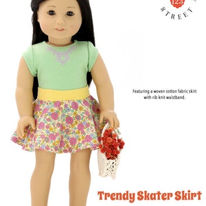 Może przedstawiać: Wz&oacute;r na ubranie dla lalki 46 cm do modnej sp&oacute;dnicy skater. Sp&oacute;dnica jest wykonana z tkanej bawełny z kwiatowym nadrukiem i ż&oacute;łtym pasem. Wz&oacute;r pochodzi z Mulberry Street 123.