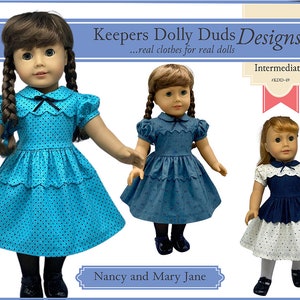 May include: Three dolls dressed in various outfits. The doll on the left is wearing a turquoise dress with black polka dots, a black bow, and black shoes. The middle doll is wearing a blue dress with a floral pattern and black shoes. The doll on the right is wearing a white and blue dress with white tights and black shoes. The text reads "Keepers Dolly Duds Designs".