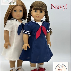 May include: Two dolls in sailor dresses. One doll wears white with a navy tie, the other navy with a red tie. The image includes the text "Let's Salute the Navy!" and "Make a 1942 sailor dress based on a vintage pattern."