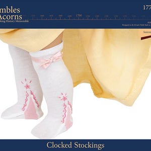 May include: White knee-high stockings with pink embroidered details and a pink bow at the top. The stockings are designed for 18 inch dolls. The text "Clocked Stockings" is printed below the image.