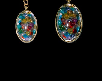 Necklace - clear resin, oval pendant with multicolored beads, gold tone 18” chain