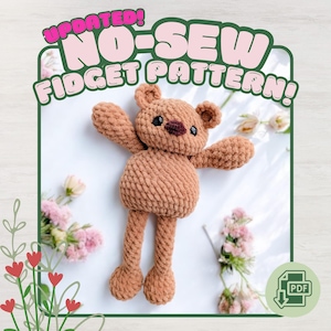 May include: A handmade brown crochet bear with outstretched arms and legs. The bear has small black eyes and a dark brown nose. Text at the top reads "UPDATED! NO-SEW FIDGET PATTERN!" The image includes a PDF download icon.