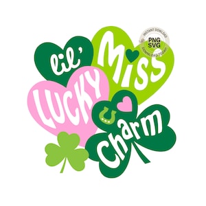 May include: A digital graphic featuring a St. Patrick's Day theme. The design includes green and pink hearts with the words "lil' Lucky Miss Charm" in white, along with a green shamrock and a horseshoe.