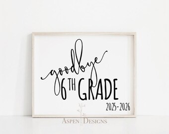 May include: A framed print with the words "goodbye 6th grade" in a stylish script and bold font. The years 2025-2026 are below the text. The frame is light-colored, and the background is white.