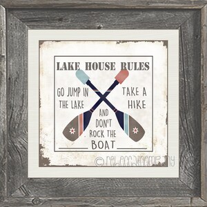 May include: A white sign with the text "LAKE HOUSE RULES" and two crossed oars with the text "GO JUMP IN THE LAKE" and "TAKE A HIKE" and "AND DON'T ROCK THE BOAT".