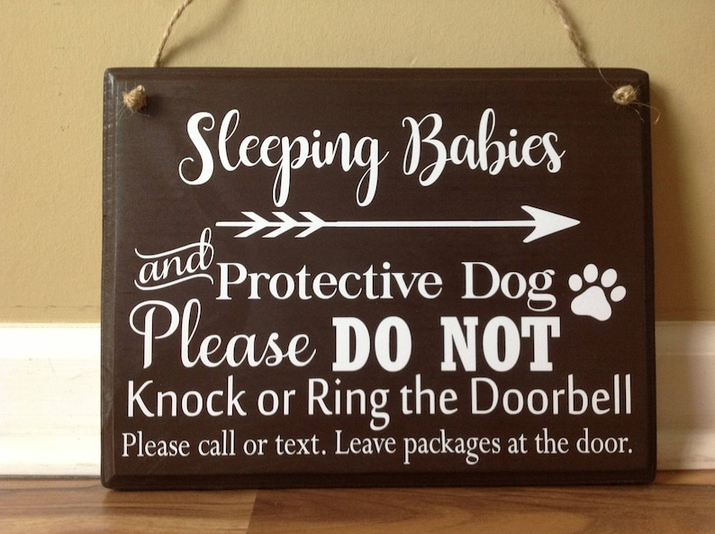 Sleeping Babies and Protective Dog Please Do Not Knock or Ring Doorbell Please call or text Leave packages hanging door sign brown white