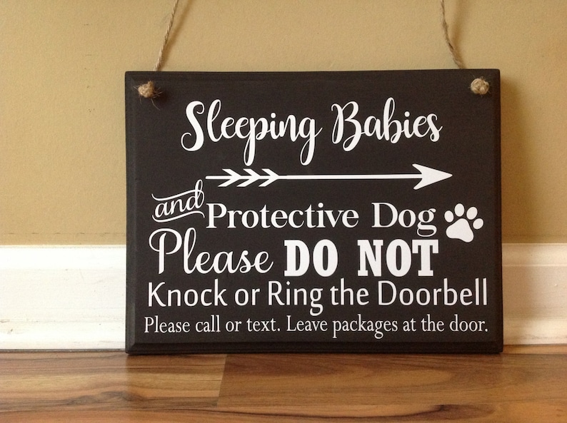 Sleeping Babies and Protective Dog Please Do Not Knock or Ring Doorbell Please call or text Leave packages hanging door sign brown white