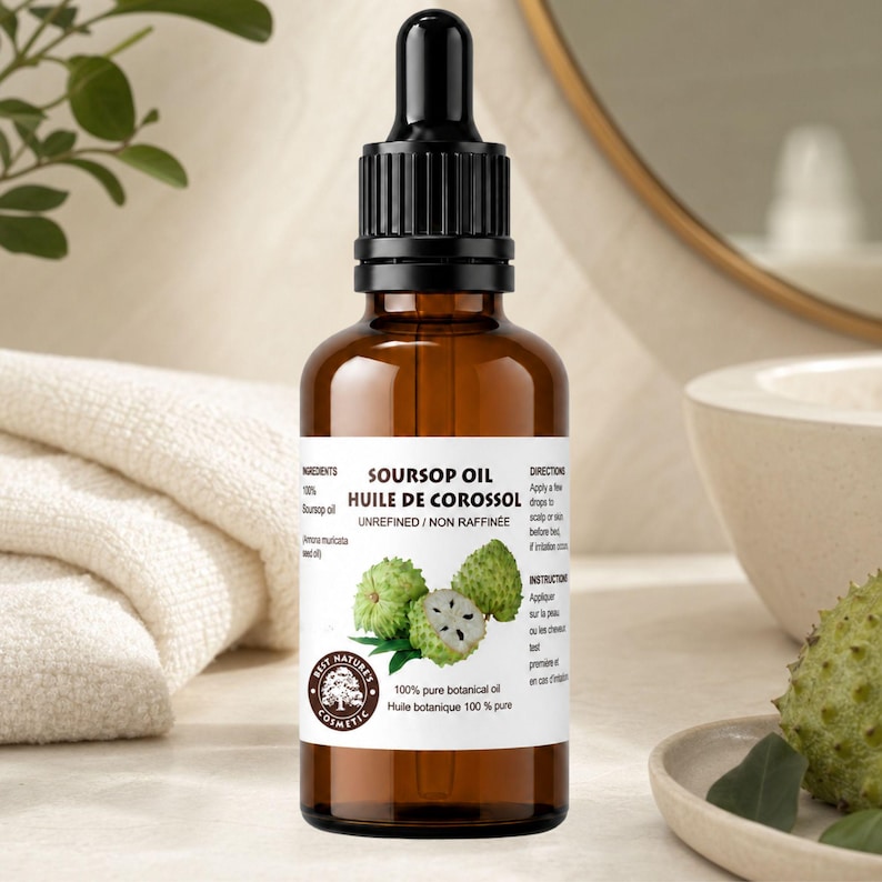 Side view amber dropper, folded towel and mirror hint, soursop face oil label, spa style tones