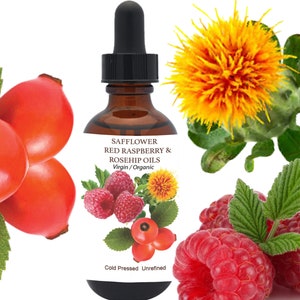 May include: A brown glass dropper bottle with a black cap containing Safflower, Red Raspberry, and Rosehip oils. The label features text reading Safflower Red Raspberry & Rosehip Oils Virgin/Organic Cold Pressed Unrefined with images of red rosehips, red raspberries, and a yellow safflower bloom.