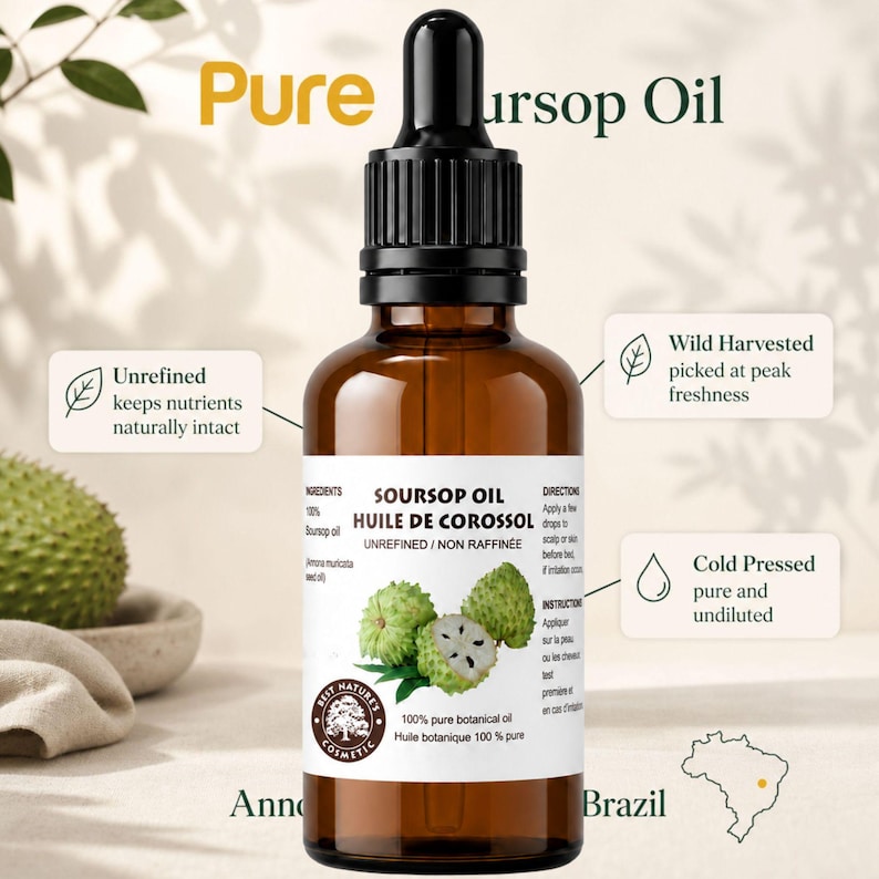 Centered amber bottle labeled pure soursop oil, botanical graviola fruit art, light cream backdrop