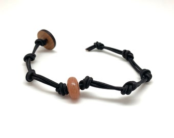 Carnelian knotted Leather bracelet with wooden OM button. Anchoring to the present moment, Courage, Trust