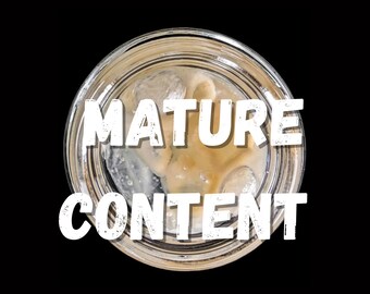 May include: Overhead view of a clear glass with ice and a light-colored liquid, against a black background. The words "MATURE CONTENT" are written in bold, white letters across the glass.