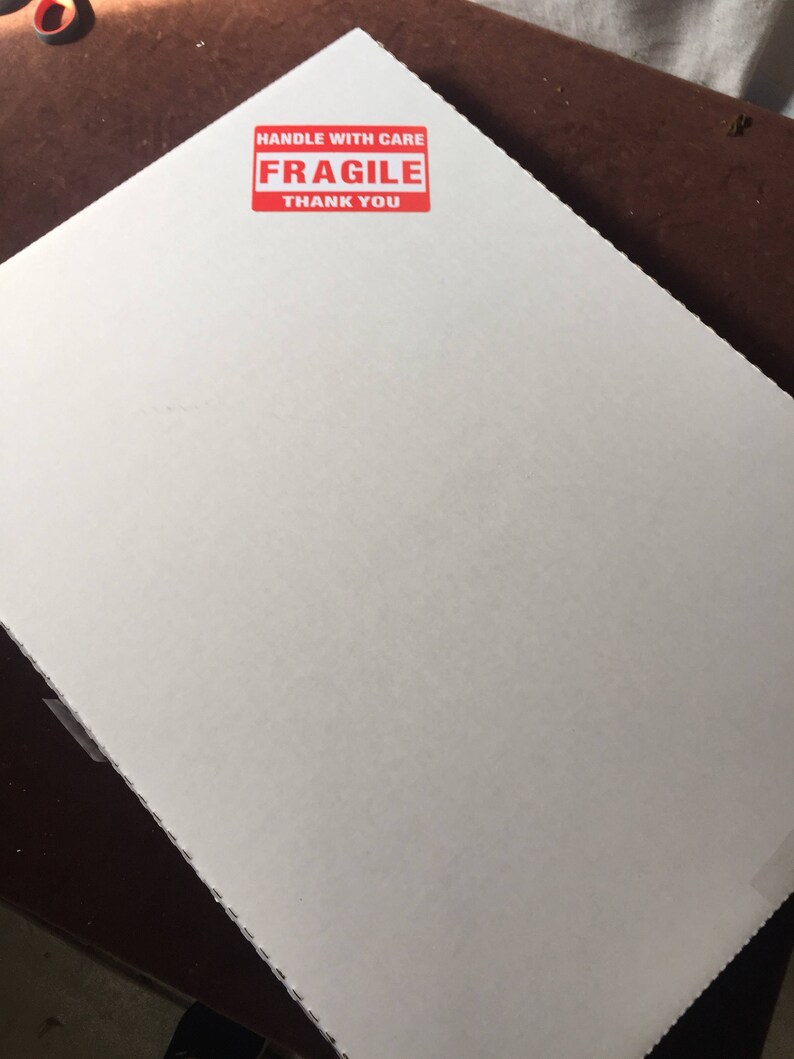 May include: White cardboard box with a red "HANDLE WITH CARE FRAGILE THANK YOU" sticker.