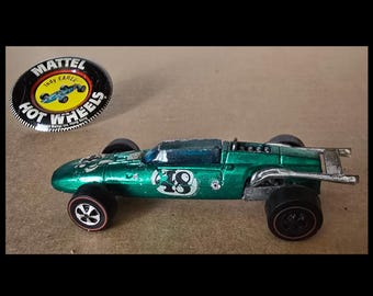 1969 green Hot Wheels Indy Eagle with metal badge. #sh145