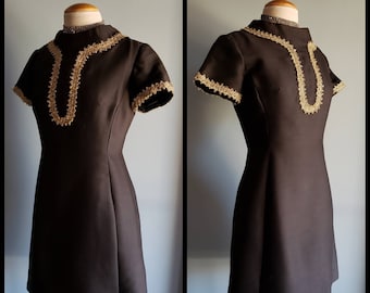 Vintage little black dress by R&K originals with gold metalic trim.