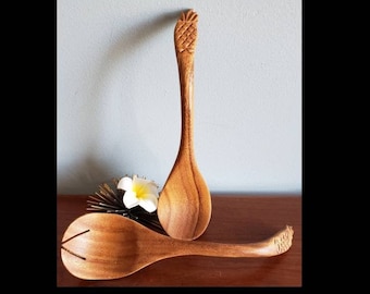Carved pineapple handle salad servers.