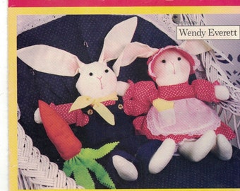 May include: A vintage sewing pattern from Butterick, pattern number 6653, for making stuffed animals. The pattern includes instructions for making a bunny, a doll, a cat, and a swan. The pattern is for one size and is designed by Wendy Everett.
