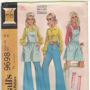 May include: A vintage sewing pattern for a women's blouse, pants, and jumper. The pattern is from McCall's and is size 14, bust 36. The pattern is illustrated with three women wearing the different pieces of clothing.