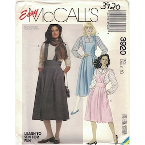 May include: McCall's sewing pattern number 3920, size 10, for a high-waisted skirt with suspenders. The pattern includes three different styles: a gray skirt, a blue skirt, and a pink skirt. The pattern is labeled "Easy" and "Learn to Sew for Fun".